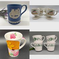 Top left: Blue Wedgwood Jasperware mug with white classical relief; Top right: Three small Frangelico Italy pedestal mugs; Bottom left: Large floral Corelle mug; Bottom right: Four white Roy Kirkham mugs with green leaves.
