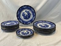 Arrangement of three stacks and one displayed plate showing all plate sizes and counts