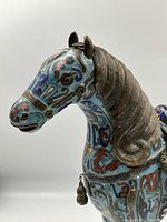 Front left angle of cloisonne horse showing head and body enamel details