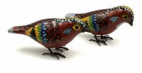 Pair of colorful cloisonne birds side view showing detailed enamel work and metal feet.