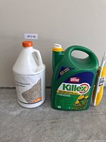 Full view of both bottles: HDX carpet shampoo and Ortho Killex weed control