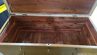 Open cedar chest showing interior cedar planks and Lane Aroma seal