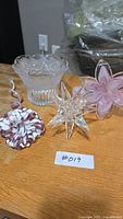 Group shot showing Mikasa bowl, star candle holder, two pink glass flowers