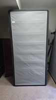 Front view of full box spring standing upright