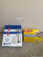 All four boxes: three Western Family tall kitchen bags, one Glad clear X-Large