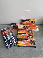 Group shot of all Cookina boxes, Alcan foil rolls and stainless utensil