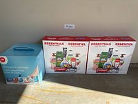 Three boxed household essentials kits side by side