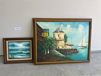 Both framed paintings side by side
