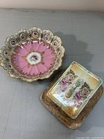 Photo of rectangular porcelain cheese dish with floral designs and central handle