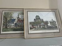 Two framed prints showing Quebec scenes with old buildings and skyline, each sized approximately 20x16 inches.