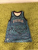 Front view of men's Puma tank top showing logo, pattern, and size large.