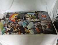 20 GameInformer magazines laid out in two rows showing various cover art and titles relevant to video games.