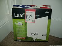 Box of Mohu Leaf Air amplified indoor antenna showing front with promotional information and price tag marked 'USED'.