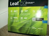 Back of the antenna box showing features like cleanpeak signal filtration, 50-mile range, 4K compatibility, storm readiness, and flexible power.