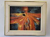Frontal photo of signed abstract oil painting on canvas by Brasso, vibrant warm colors with dark contrasting background in beige frame.