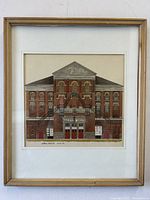 Front-facing view of framed Massey Hall art print hanging on white wall.