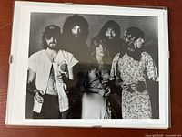 Front view of the framed black and white Fleetwood Mac publicity photo showing all five band members.