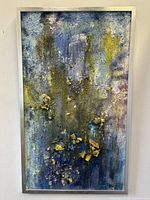 Frontal image showing full view of abstract 3-D oil painting in silver frame, signed E Matis.