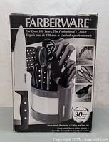 Photo of the front of the Farberware 30-Piece Carousel Cutlery and Tools Set box showing carousel stand with knives and tools.