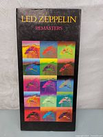 Front cover of Led Zeppelin Remasters compilation album showing colorful bird graphics in a grid.