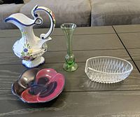 Overview photo showing all four items: ceramic pitcher, green bud vase, clear glass bowl, and decorative ceramic bowl.