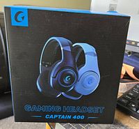 Photo of the Captain 400 gaming headset product box showing headset image and branding.