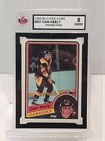 Front of graded 1984-85 O-Pee-Chee Cam Neely Rookie Card with KSA grade 8 NMM label.