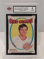 Front view of the graded Marcel Dionne rookie card showing player portrait and card condition grade.