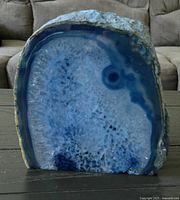 Front view of the blue agate slice showing polished surface with natural banding.