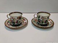 Two teacups and two matching saucers, showing full set
