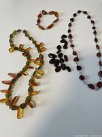 Full view of Baltic amber necklace, bracelet, loose beads, and partially completed necklace.
