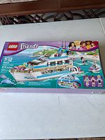 Front of original LEGO Friends Set 41015 box showing the yacht, mini-dolls, and accessories.