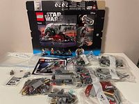 Damaged retail box, instruction manual, sealed and opened parts bags, sticker sheet