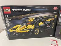 Box of LEGO Technic Set 42151 Bugatti Bolide with yellow and black car image and piece count 905 on the front