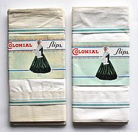 Two sets of pillow cases side by side, showing brand label Colonial Slips with vintage packaging illustration