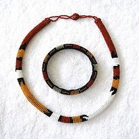 Beaded necklace and bangle set laid flat showing full items and color pattern