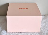 Closed soft pink Boomba box with the brand name on top.
