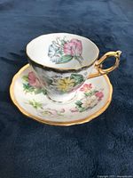 Photo showing Shafford floral tea cup with gold rim and Windsor saucer with floral pattern