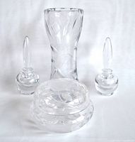 Photo of the entire lot showing two scent bottles with stoppers, one flower vase, and one covered jar arranged together on white background
