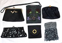 Overview of the six bags, showing various textures and embellishments in black satin and beads
