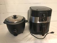 Photo of both Master Chef air fryer and Parini rice cooker together on a white surface, showcasing their overall design and condition.