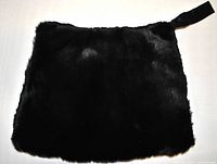 Front side of the Victorian muff showing dark brown fuzzy fur surface, measuring approx 36 x 27 cm.