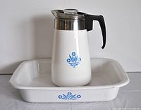 Coffee pot and pan together showing blue cornflower motif.