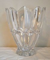 Front view of the vintage Slovenian lead crystal pedestal vase showing the 9-point cut rim and faceted pattern on the body and pedestal base.