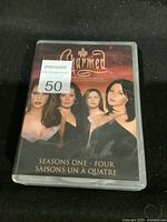 Front cover of the DVD set showing the four main actresses and title with seasons one to four.