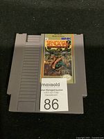 Front view of NES P.O.W. Prisoner of War cartridge with label showing colorful artwork and title