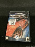 Front cover of Nintendo GameCube game case for Need for Speed Underground showing red car artwork and game branding.