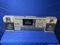 Full front view of entire unit on blue cloth background