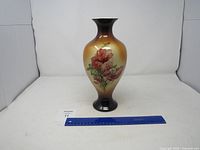 Front view of IOGA Warwick floral ceramic vase with measuring ruler for scale