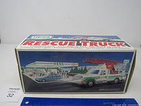 Full view of original box showing graphic of Hess Rescue Truck and gas station scene